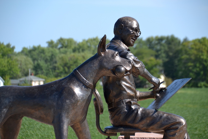 Photos by Tom Rivers: These statues of Marmaduke and his creator Brad Anderson were unveiled on July 2 in Brocton, a community in Chautauqua County where Anderson grew up. 
