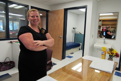 Jr./Sr. High School nurse Bethanie Mason stands in the new nurse's office, which can now accommodate wheelchairs.  This will be Mason's first full year as school nurse.  "I think the kids will like it," she said.  In addition to the main office and the nurse's office, the Jr./Sr. High counseling office also underwent renovations.