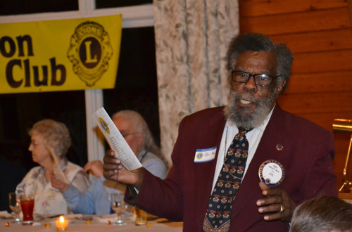 The Rev. Wilfred Moss, a past president of the Lions Club and a member since 1997, leads the group prayer during the Club’s 90th anniversary celebration in 2014. 