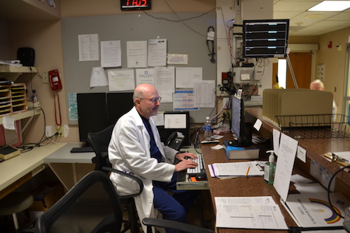 Dr. Richard Elman enters data into the computer in the Emergency Room at Medina Memorial Hospital.