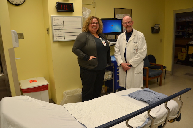MacKenzie Smith and Dr. Richard Elman are pictured in one of the trauma rooms with a new mounted computer, which makes it quicker to enter and check medical data.