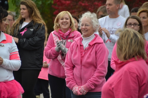 Peggy Lemcke, a teacher’s aide at Albion Central School, is applauded before the walk for being a cancer survivor for 16 years now.