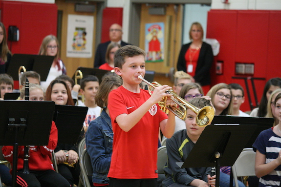 Sixth grader Chris Lyndaker plays “Taps.”