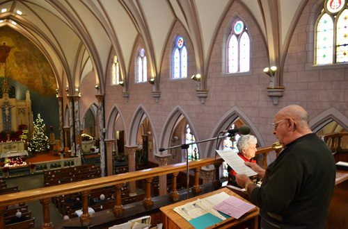 Joe Sacco is shown during a Christmas Mass in 2013 with Harriette Greaser. They will both be performing on Sunday.