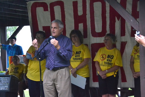 Yates Town Supervisor Jim Simon speaks against the proposed Lighthouse Wind project during a rally in the pouring rain on Aug. 25 in Somerset at Golden Hill State Park. About 200 people attended the rally in a downpour.