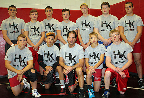 Photo By Mike Wertman – Coach John Grillo meets here with veteran Holley and Kendall wrestlers in the newly merged squad. In front are Jeremy Browe, Nate Schoonmaker, Coach Grillo, Tristyn Moyer and Branden Gardner. In back are Braxton Leary-Hart, Erik Balys, Zach Day, Dalton Moyer, Dawson Cutter, Brandon Stewart and Dylan Spellan.