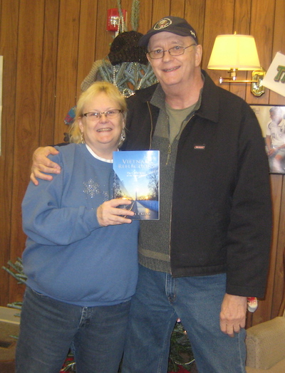 Provided photo: Don Sisson presents a copy of the book, Vietnam Reflections by Michael T. Keene, to the Community Free Library in Holley. Sandra Shaw, library director, accepts the book from Sisson, whose brother Ronnie P. Sisson was killed in Vietnam on Dec. 16, 1965.