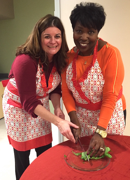 Provided photo: Vickie (Cooper) Elsenheimer showed Cherise Oakley how to make collard greens with smoked turkey butt.