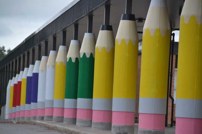 Pencil molds at elementary school are painted several different colors