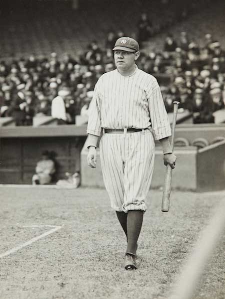 Babe Ruth coming to home plate after hitting a home run in game